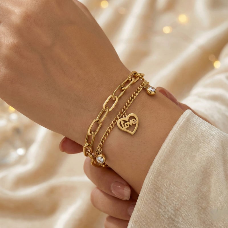 A gold bracelet made of rust-resistant stainless steel, with two layers of chains, heart-shaped pendants filled with the word Love with shiny stones, and an adjustable clasp to fit you. - Image 3